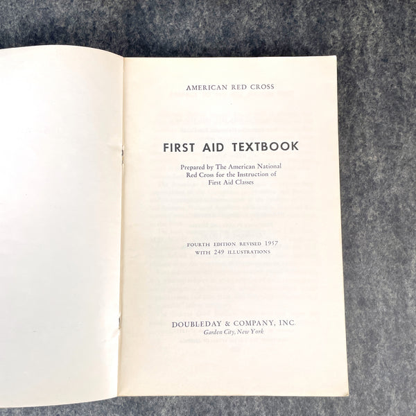 First Aid - Fourth Edition - Red Cross textbook - 1957- green softcover - NextStage Vintage