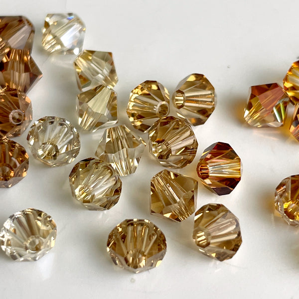 5mm bicone crystal beads Swarovski? - 288 pcs - topaz shades - estate destash