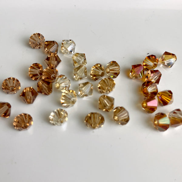 5mm bicone crystal beads Swarovski? - 288 pcs - topaz shades - estate destash