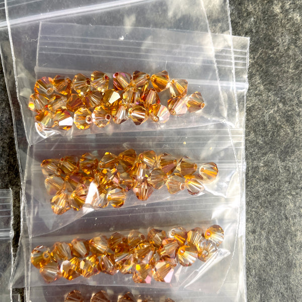 5mm bicone crystal beads Swarovski? - 288 pcs - topaz shades - estate destash