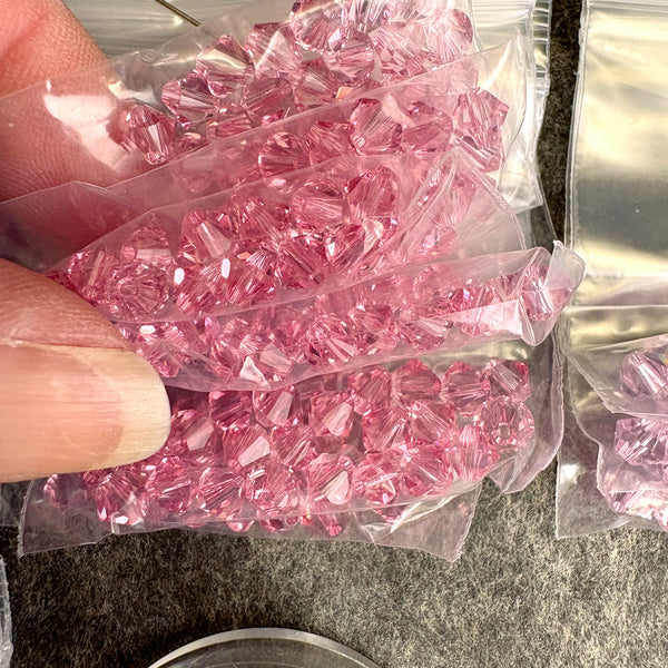 447 pcs 5mm bicone crystal beads - Swarovski? - pastel pinks and purples