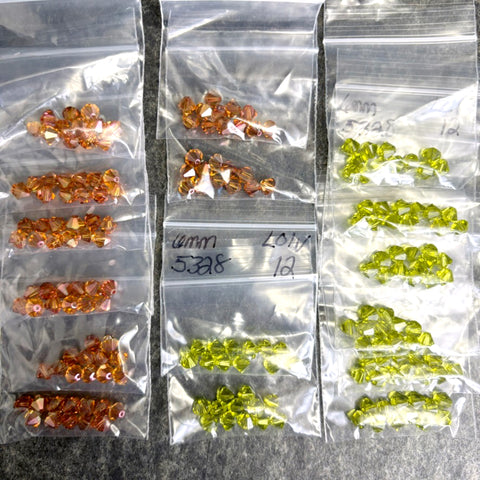 192 bicone crystal beads 6mm - lt olivine, topaz - Swarovski? - destash lot - NextStage Vintage