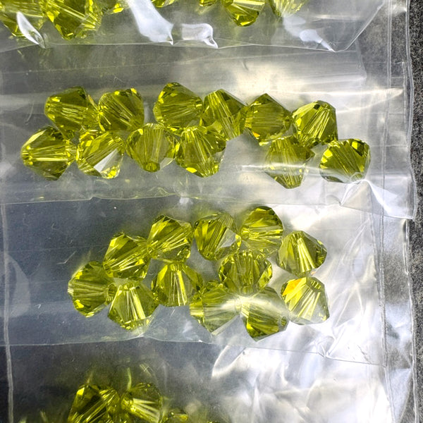 192 bicone crystal beads 6mm - lt olivine, topaz - Swarovski? - destash lot - NextStage Vintage
