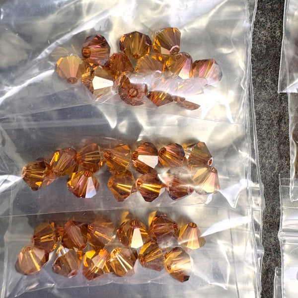 192 bicone crystal beads 6mm - lt olivine, topaz - Swarovski? - destash lot - NextStage Vintage