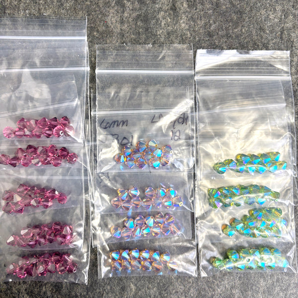 156 pcs 6mm crystal bicone beads - LAmy2x, green2x, purple - Swarovski? destash