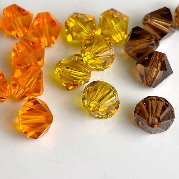 6mm crystal bicone beads Swarovski? - 144 pc. - brown, orange, yellow - estate destash