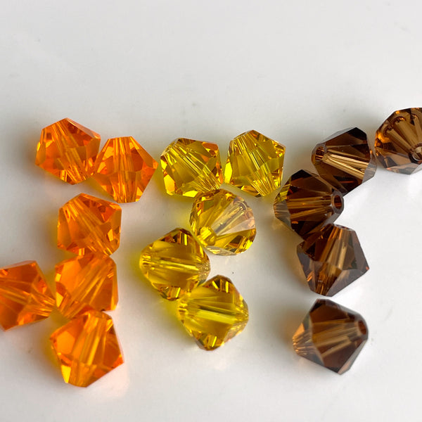 6mm crystal bicone beads Swarovski? - 144 pc. - brown, orange, yellow - estate destash