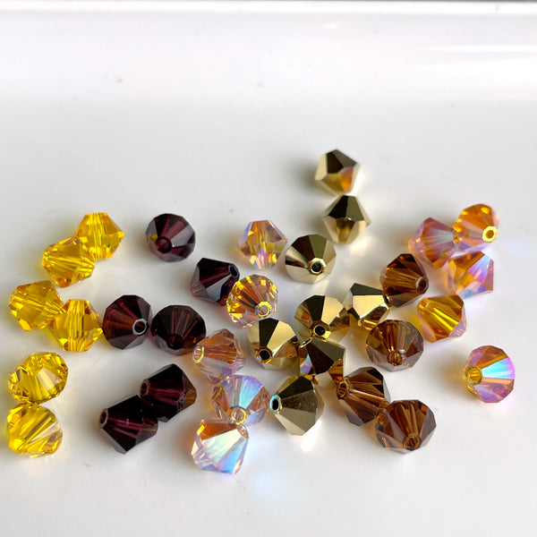 6mm crystal bicone beads Swarovski? - 156+ pcs - golds and browns - estate destash