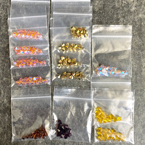 6mm crystal bicone beads Swarovski? - 156+ pcs - golds and browns - estate destash