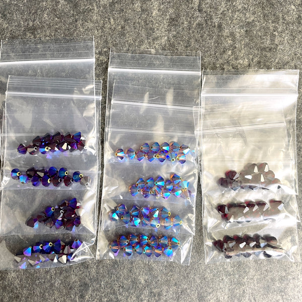 6mm crystal bicone beads Swarovski? - 144 pc - reds, purples - estate destash