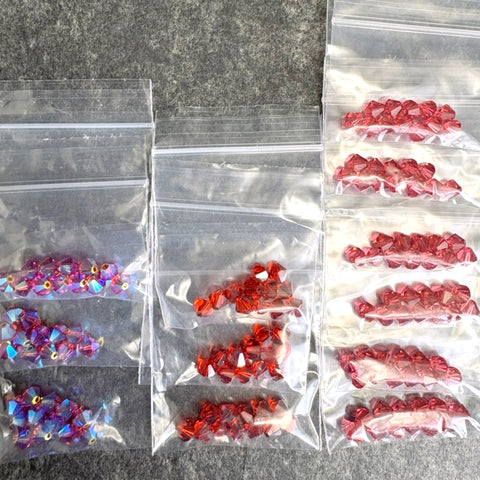 144 pc 6mm crystal bicone beads - 3 rosy oranges - Swarovski? destash