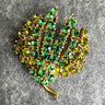 Rhinestone leaf brooch - goldtone with emerald and olivine rhinestones - NextStage Vintage