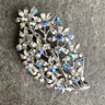Floral spray rhinestone brooch - silvertone with aurora borealis crystals - NextStage Vintage