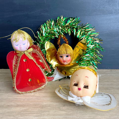 three vintage christmas angels with plastic heads