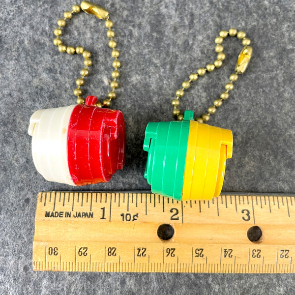 Coin holder key chains - hard plastic - 1970s