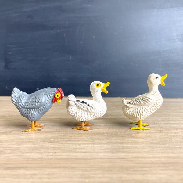 Compostion putz ducks and rooster with metal feet - possibly German