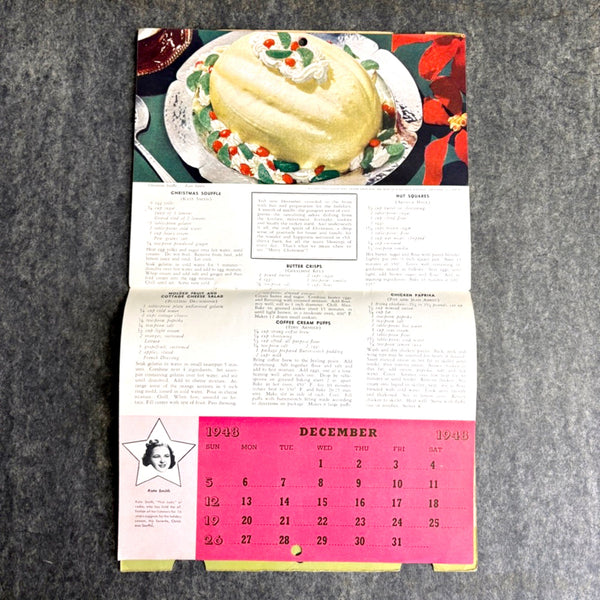Open book with a recipe and calendar on a gray background