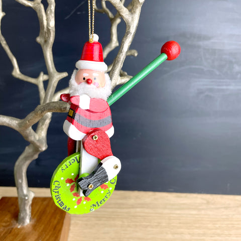 Kurt Adler Santa riding a unicycle wooden ornament - 1982 vintage