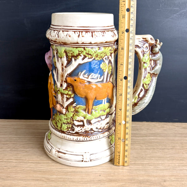 Oversized ceramic stein hand painted - 1970s vintage - deer hunter squirrel trees