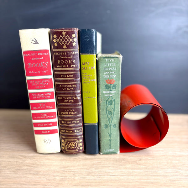 Coiled steel bookworm bookend - 1960s vintage - bright red - orange