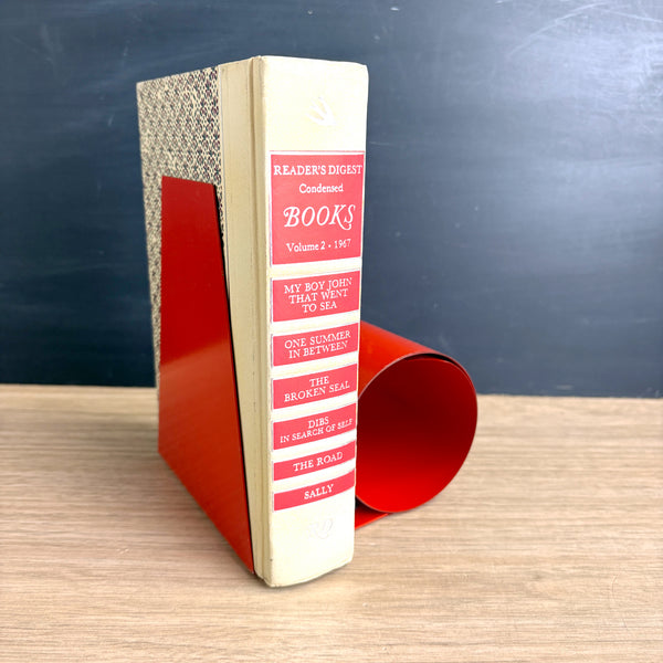 Coiled steel bookworm bookend - 1960s vintage - bright red - orange
