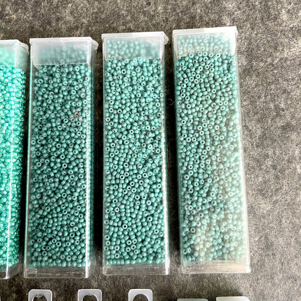 600 grams of 11/0 round seed beads - blues and greens - destash lot