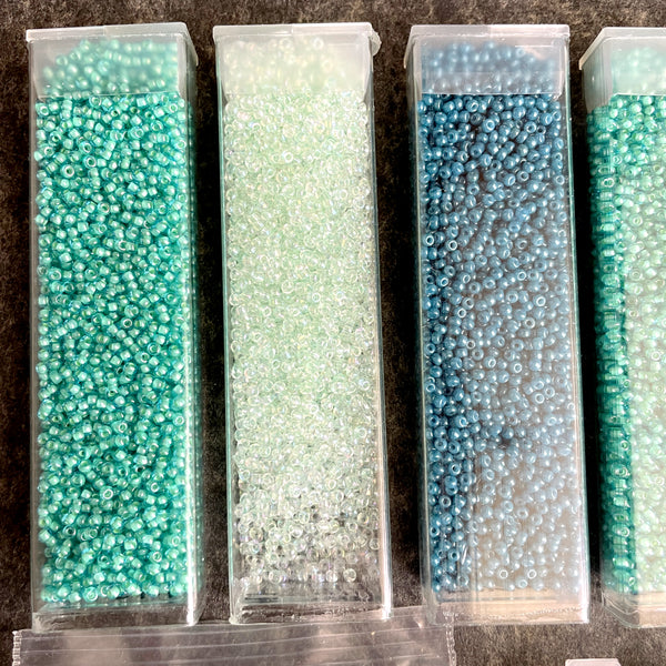 600 grams of 11/0 round seed beads - blues and greens - destash lot