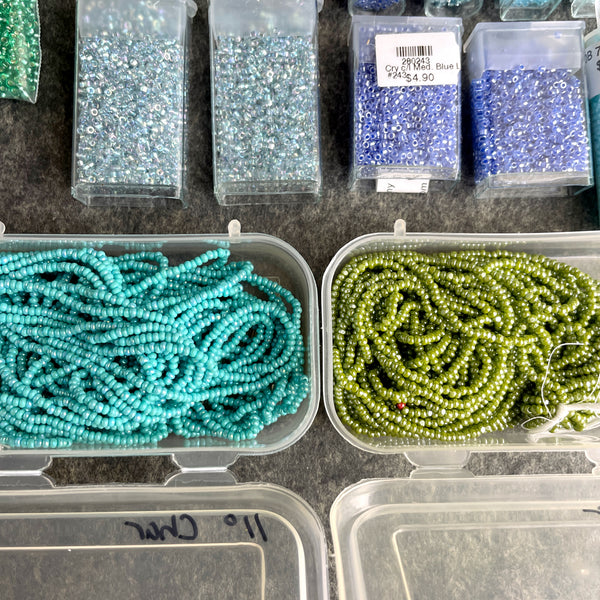 600 grams of 11/0 round seed beads - blues and greens - destash lot