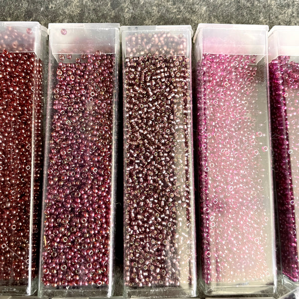 850 grams of 11/0 round seed beads - earth tones - estate destash lot