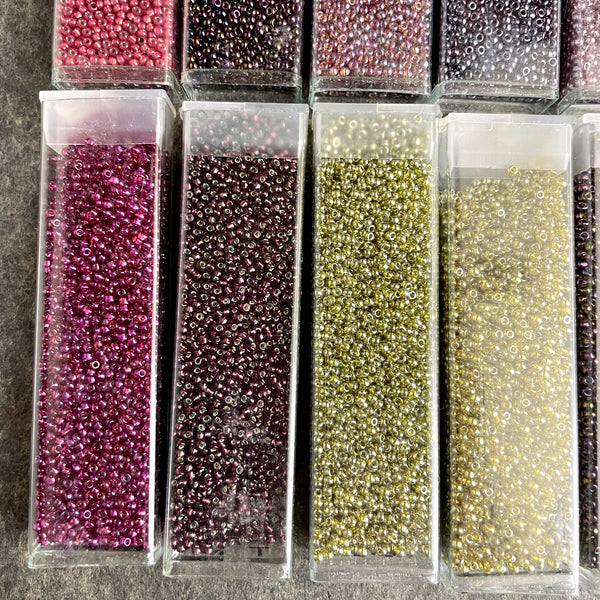 850 grams of 11/0 round seed beads - earth tones - estate destash lot