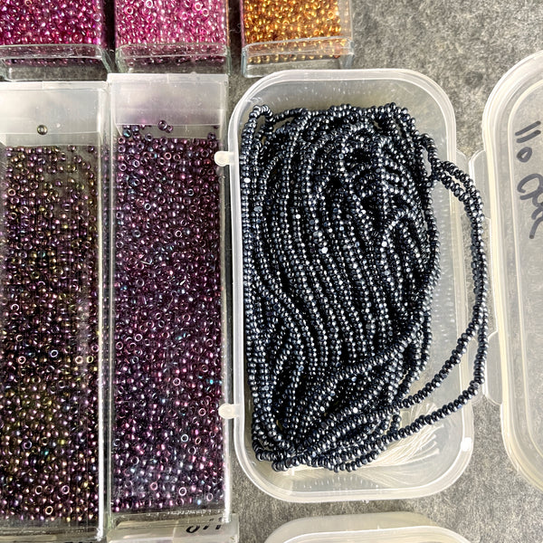 850 grams of 11/0 round seed beads - earth tones - estate destash lot