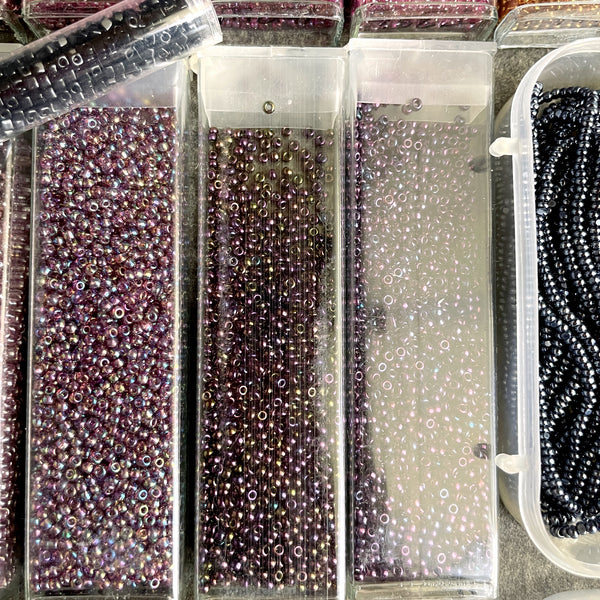 850 grams of 11/0 round seed beads - earth tones - estate destash lot