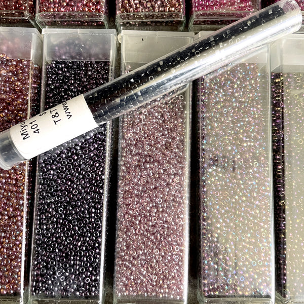 850 grams of 11/0 round seed beads - earth tones - estate destash lot