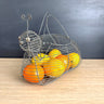 Snail-shaped handled wire basket - fruit, garden, egg - rustic vintage - NextStage Vintage