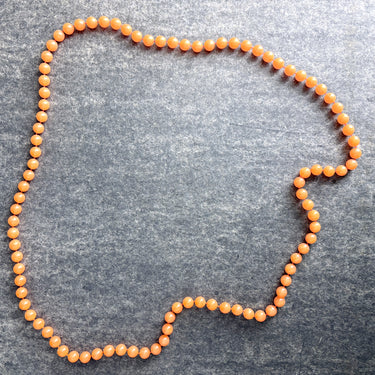Tangerine orange plastic beaded rope necklace – 60s vintage - NextStage Vintage