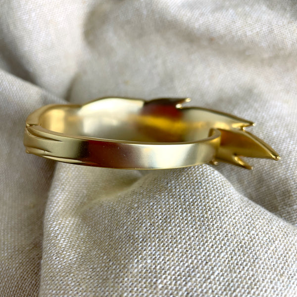 Trina Turk goldtone hinged leaf cuff bracelet
