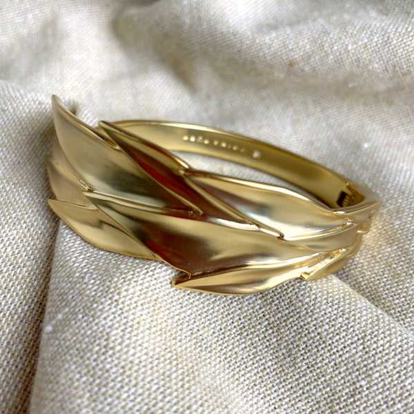 Trina Turk goldtone hinged leaf cuff bracelet