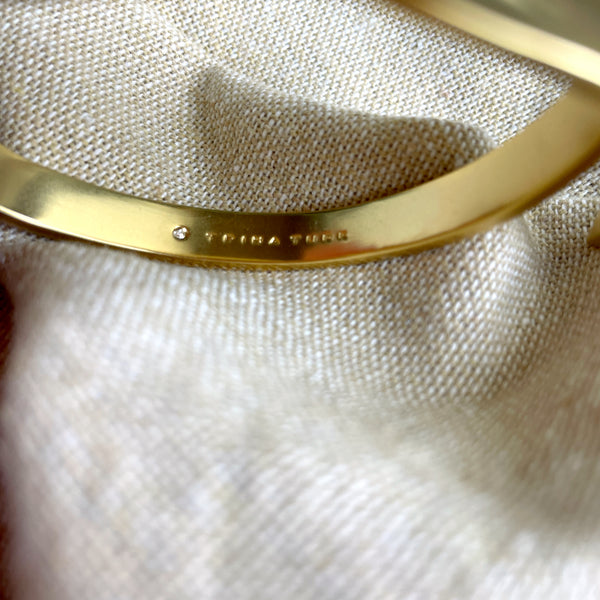 Trina Turk goldtone hinged leaf cuff bracelet