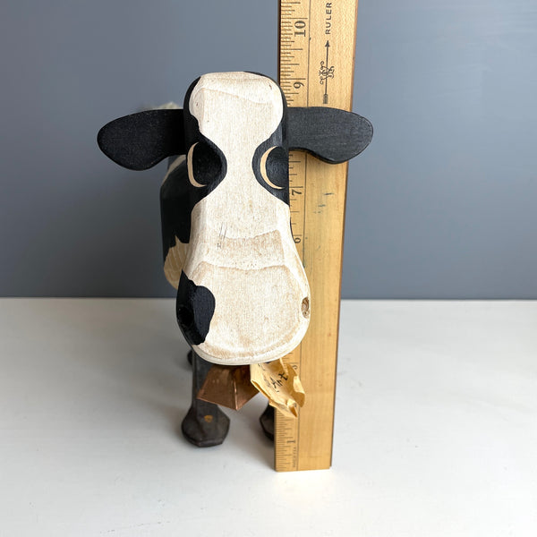 Folk art wooden holstein cow with iron spike legs - made by Bob and Jean Rich - 1980s vintage - NextStage Vintage
