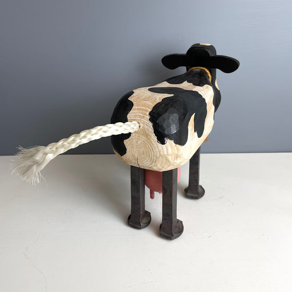 Folk art wooden holstein cow with iron spike legs - made by Bob and Jean Rich - 1980s vintage - NextStage Vintage